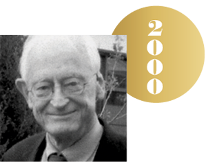 Black and white headshot of Alan MacDiarmid with an overlapping gold circle representing a Nobel medal, with the year 2000 on it.