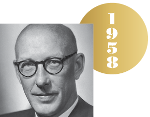 Black and white headshot of Edward Tatum with an overlapping gold circle representing a Nobel medal, with the year 1958 on it.
