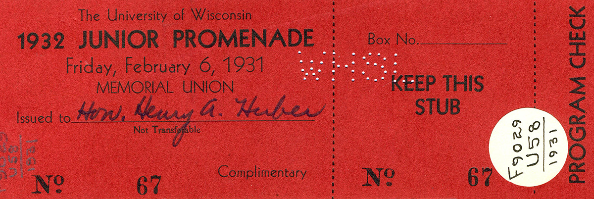 A red event ticket for the University of Wisconsin’s 1932 Junior Promenade, held February 6, 1931, at Memorial Union. The ticket is marked 'Complimentary,' includes spaces for a box number, and has a handwritten name indicating to whom it was issued.