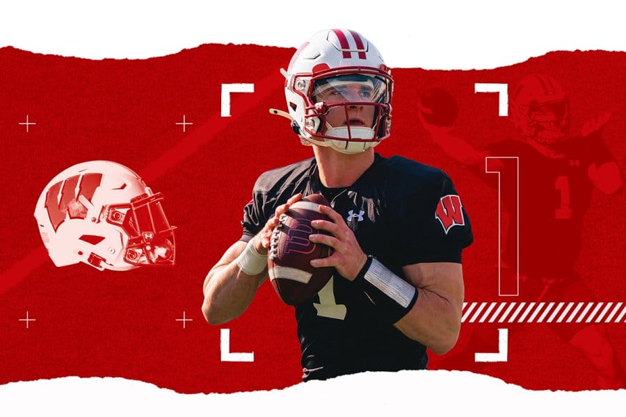 A graphic illustration of a Wisconsin Badgers football quarterback wearing jersey number 1, holding a football set against a red torn-paper backdrop featuring football graphics and camera crosshairs.