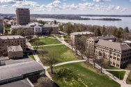 An aerial view of Bascom Hill and surrounding campus buildings overlooking Lake Mendota.