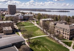 An aerial view of Bascom Hill and surrounding campus buildings overlooking Lake Mendota.