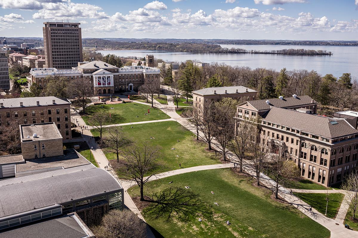 An aerial view of Bascom Hill and surrounding campus buildings overlooking Lake Mendota.